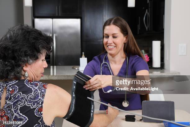 home health care blood pressure test ms - prophylaxie stock pictures, royalty-free photos & images