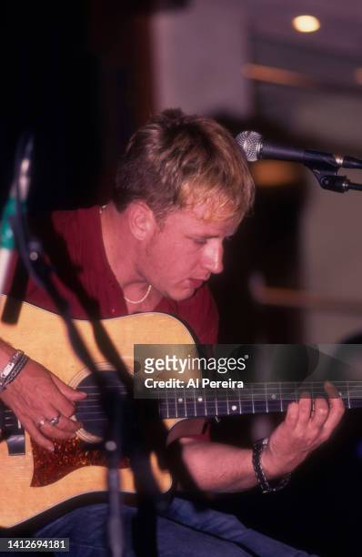 Andy Dunlop and the band Travis perform at an in-store appearance at the Virgin Megastore at Union Square on June 26, 2001 in New York City.