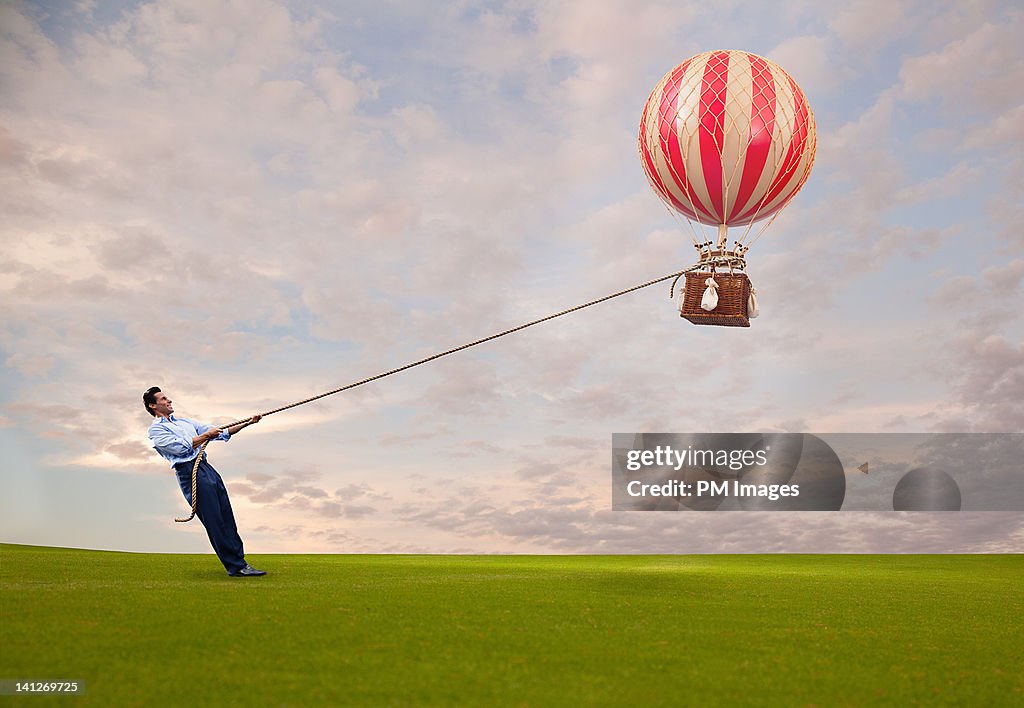 Man holding hot air balloon