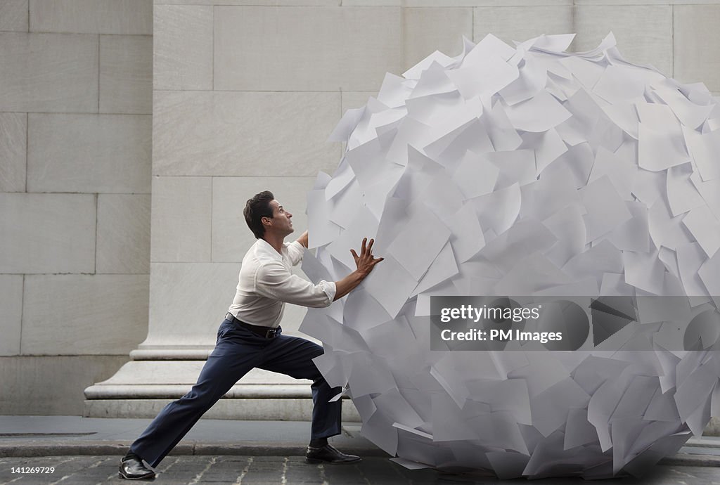 Pushing big ball of paper