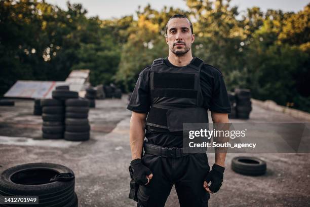 swat team soldier - bulletproof stock pictures, royalty-free photos & images