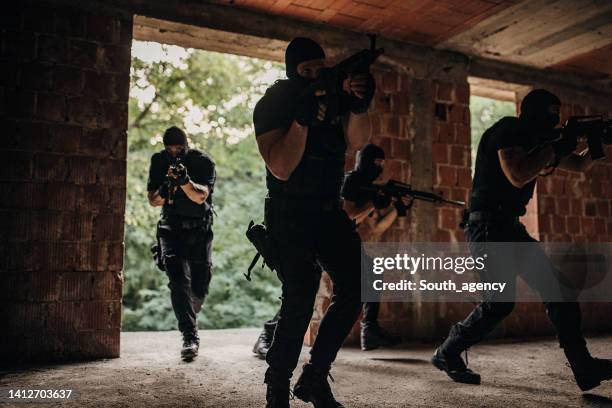 swat team in action - balaclava gun stock pictures, royalty-free photos & images