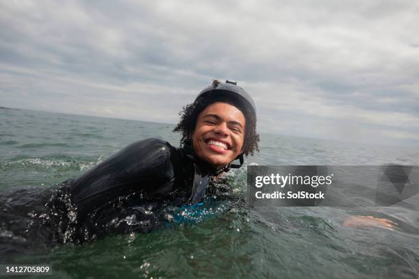 happy to be in the ocean - wetsuit stock pictures, royalty-free photos & images