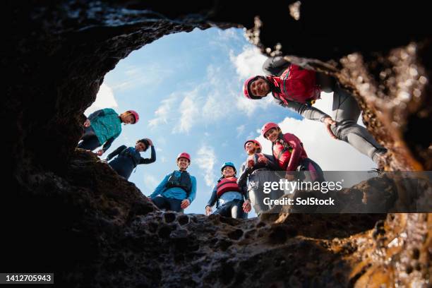 discovering the caves of the coast - pothole stockfoto's en -beelden