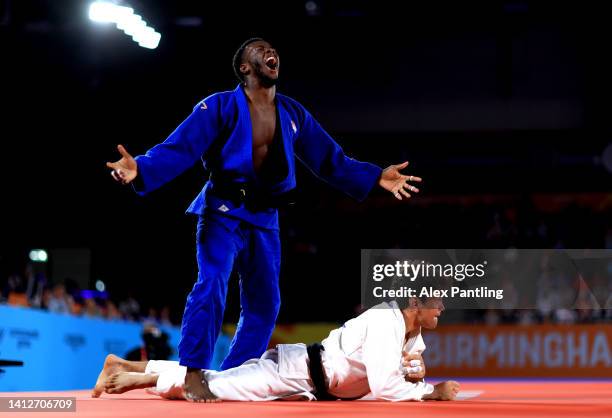 Jamal Petgrave of Team England celebrates after defeating Remi Feuillet of Team Mauritius in the Men's Judo 90 kg Final match on day six of the...