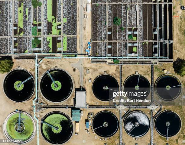 an aerial view of a sewage treatment plant at sunrise - south east england stock pictures, royalty-free photos & images