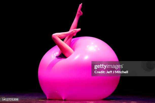 An artist from La Clique performs in the McEwan Hall at the launch of the Underbelly at the Edinburgh Festival Fringe on August 03, 2022 in...