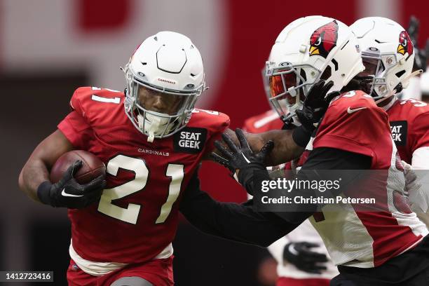 Running back T.J. Pledger of the Arizona Cardinals participants in a team training camp at State Farm Stadium on August 03, 2022 in Glendale, Arizona.