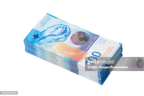 stack of 100 swiss francs banknotes - bundle stock-fotos und bilder