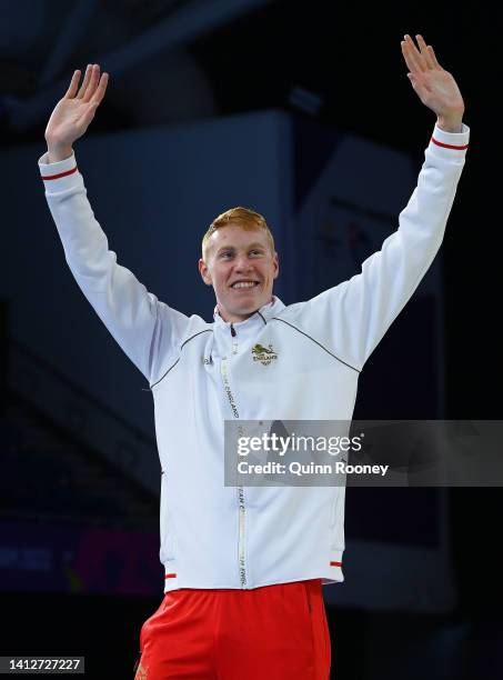 Silver medalist, Tom Dean of Team England waves during the medal ceremony for the Men's 200m Individual Medley Final on day six of the Birmingham...