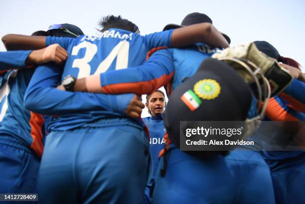 Harmanpreet Kaur of Team India speaks to their team in a huddle during the Cricket T20 Group A match between Team India and Team Barbados on day six...
