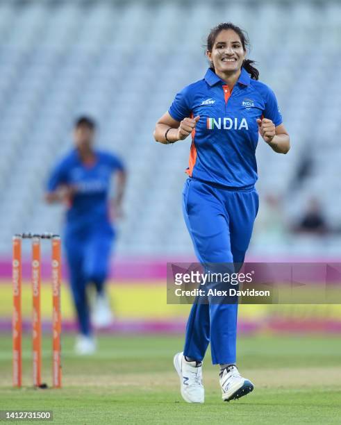 Renuka Singh Thakur of Team India celebrates after taking the wicket of Hayley Matthews of Team Barbados during the Cricket T20 Group A match between...
