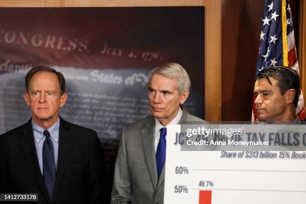 Sen. Pat Toomey , Sen. Rob Portman , and Sen. Todd Young listen during a press conference on taxes at the U.S. Capitol Building on August 03, 2022 in...
