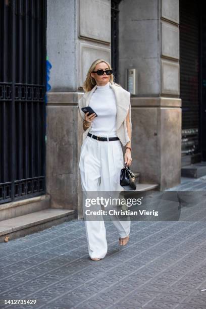 Claire Rose Cliteur is seen wearing shoes Ilio Smeraldo x Claire Rose, trousers in white paper moon, turtleneck top paper moon, black belt The Row,...