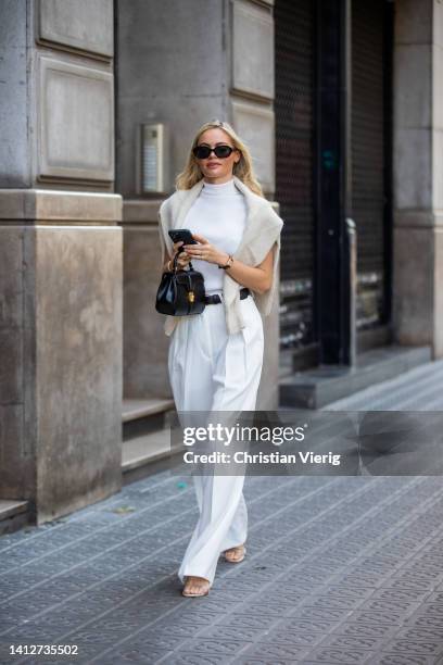 Claire Rose Cliteur is seen wearing shoes Ilio Smeraldo x Claire Rose, trousers in white paper moon, turtleneck top paper moon, black belt The Row,...