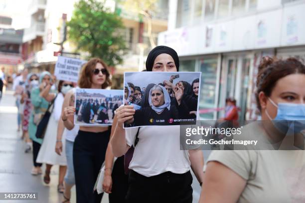 Women take part in a protest in commemoration of the victims of the Yazidi massacre on its 8th anniversary in Izmir, Turkey, on Wednesday, August 3,...