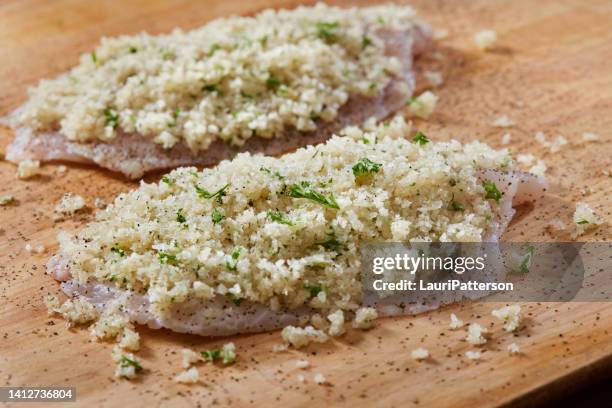 preparing parmesan crusted tilapia - halibut fillet raw stock pictures, royalty-free photos & images
