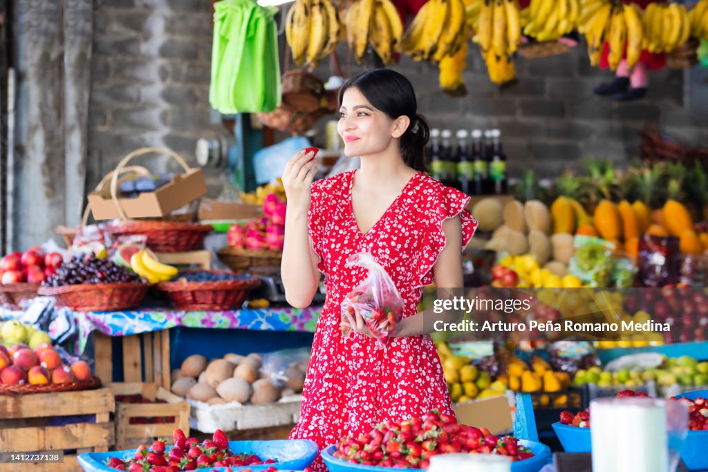 Tasting strawberries at the market