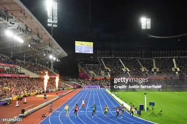 General view inside the stadium as Ferdinand Omanyala of Team Kenya celebrates after winning the Gold medal in the Men's 100m Final on day six of the...
