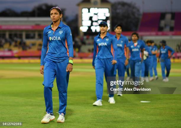 Harmanpreet Kaur of Team India leads the team off of the field following the Cricket T20 Group A match between Team India and Team Barbados on day...