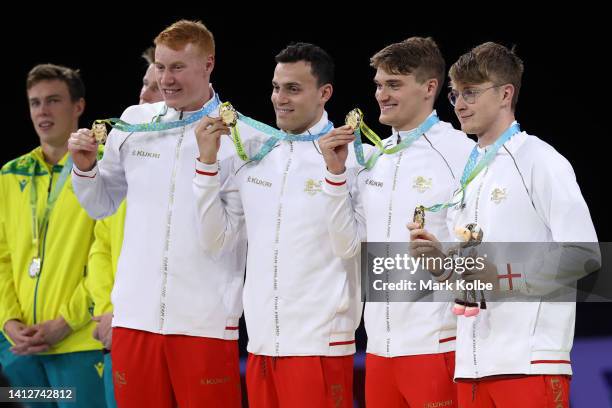 Gold medalists, Tom Dean, Brodie Paul Williams, James Wilby and James Guy of Team England pose with their medals during the medal ceremony for the...