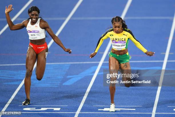 Elaine Thompson-Herah of Team Jamaica beats Daryll Neita of Team England across the finish line to win the gold medal in the Women's 100m Final on...