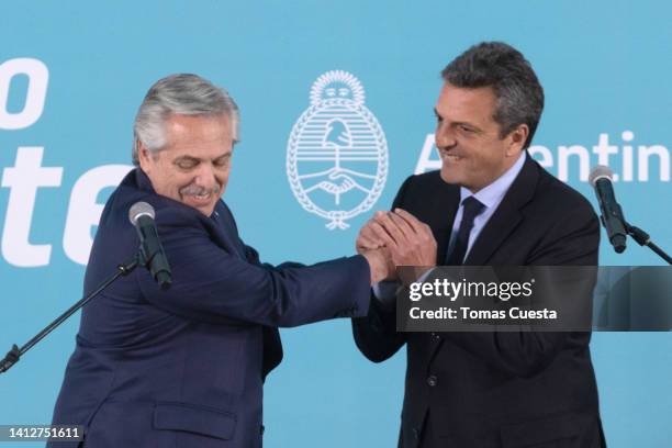 President of Argentina Alberto Fernandez shakes hands with newly appointed minister of Economy Sergio Massa after after taking office during a...