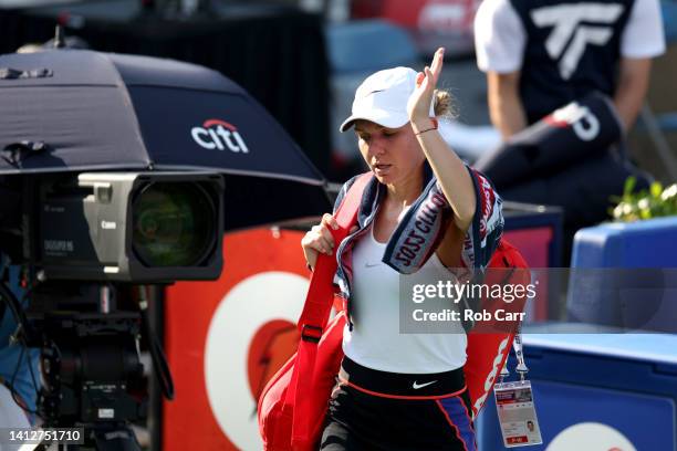 Simona Halep of Romina walks off the court after retiring from her match against Anna Kalinskaya of Russia due to illness during Day 5 of the Citi...