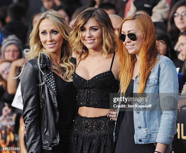 Singer Miley Cyrus , mom Tish Cyrus and sister Brandi Cyrus arrive at the Los Angeles Premiere "The Hunger Games" at Nokia Theatre L.A. Live on March...