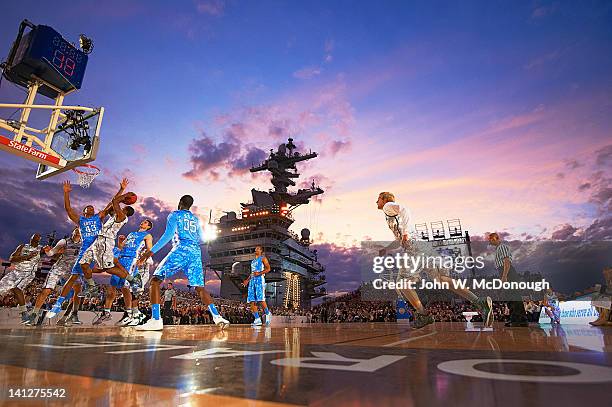 Quicken Loans Carrier Classic: North Carolina James Michael McAdoo in action, defense vs Michigan State Keith Appling aboard USS Carl Vinson aircraft...