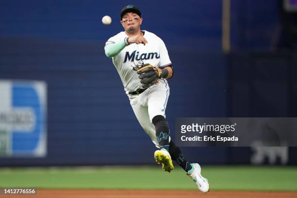 Miguel Rojas of the Miami Marlins throws towards first base during the eighth inning against the Cincinnati Reds at loanDepot park on August 03, 2022...