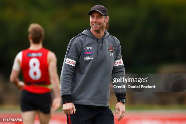 Bombers head coach Ben Rutten smiles during an Essendon Bombers AFL training session at The Hangar on August 04, 2022 in Melbourne, Australia.