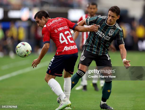 Javier Hernandez of Los Angeles Galaxy blocks the pass of Omar Mireles of the Guadalajara Chivas during the first half of the Leagues Cup Showcase...