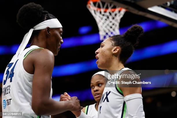 Sylvia Fowles and Aerial Powers of the Minnesota Lynx react during the second quarter against the Seattle Storm at Climate Pledge Arena on August 03,...