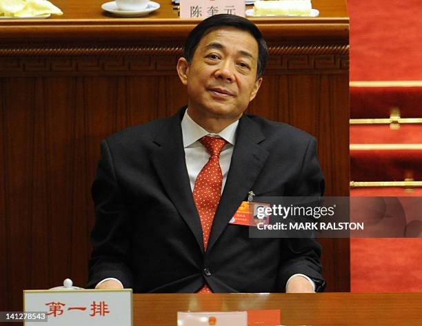 Chongqing Party Secretary Bo Xilai attends the closing ceremony of the National People's Congress at the Great Hall of the People in Beijing on March...