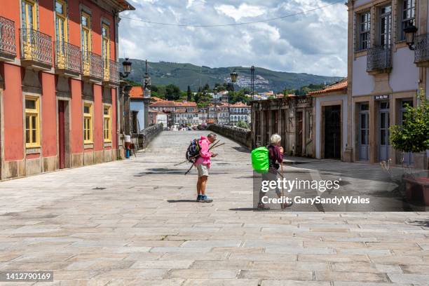 hiking the camino de santiago pilgrimage trail, ponte de lima, portugal - camino de santiago stock pictures, royalty-free photos & images