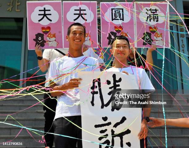 Eizaburo Ariyoshi, left, and Lu Yingren celebrate the high court’s decision to allow their marriage on July 21, 2022 in Taipei,Taiwan. The Taipei...