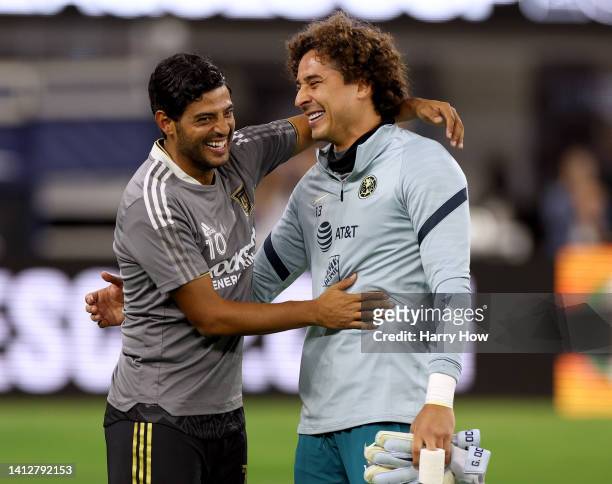 Carlos Vela of Los Angeles FC and Guillermo Ochoa of Club America laugh before the game during the Leagues Cup Showcase 2022 at SoFi Stadium on...