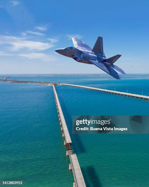 army jet fighter flying over the florida keys - seven mile bridge stock pictures, royalty-free photos & images