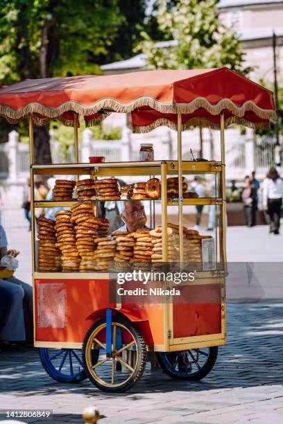 food stand in istanbul selling turkish bagel - cart stock pictures, royalty-free photos & images