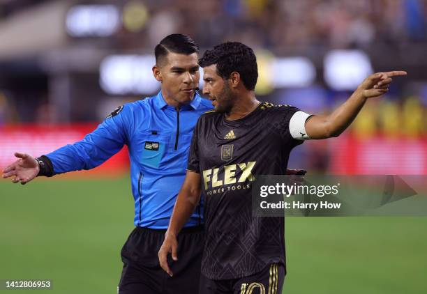 Carlos Vela of Los Angeles FC argues a call with referee Victory Rivas in a loss to Club America during the Leagues Cup Showcase 2022 at SoFi Stadium...
