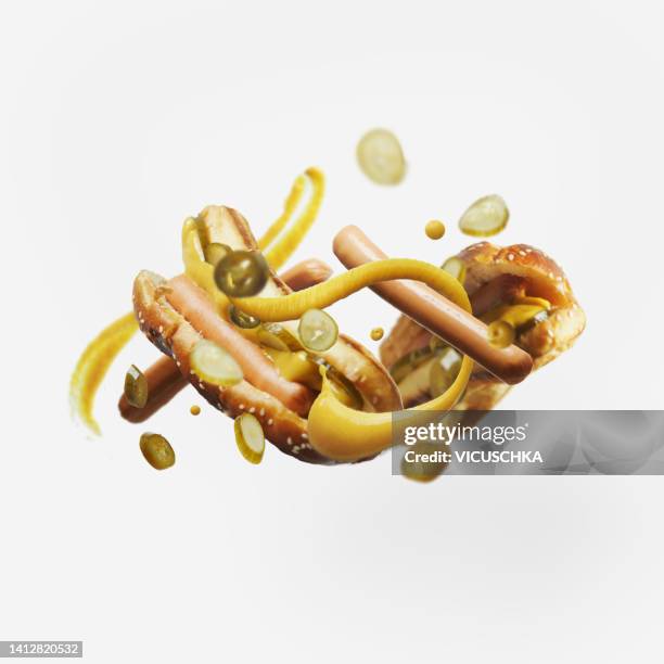 hot dog with ingredient flying at white background - food mid air stock pictures, royalty-free photos & images