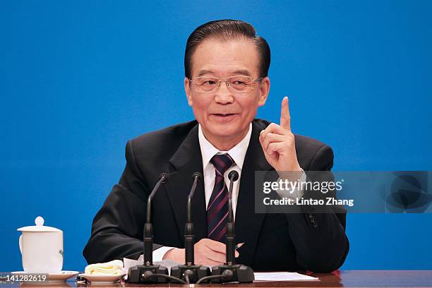 China's Premier Wen Jiabao gestures as he answers a question during his annual press conference after the closing of the session of the National...