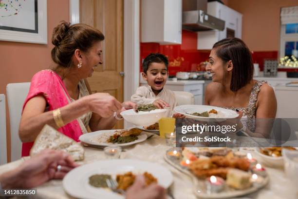 try some of this - diwali family stock pictures, royalty-free photos & images