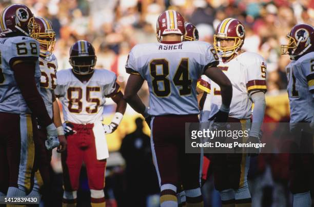 Heath Shuler, Quarterback for the Washington Redskins gives instructions in the huddle to his offensive line during the National Football Conference...
