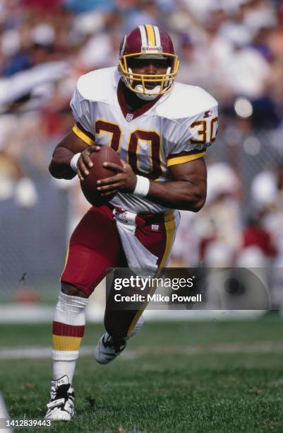 Brian Mitchell, Running Back for the Washington Redskins runs the football during the American Football Conference Central Division game against the...
