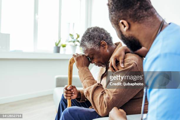 senior patient receiving bad news. - receiving treatment concerned stock pictures, royalty-free photos & images