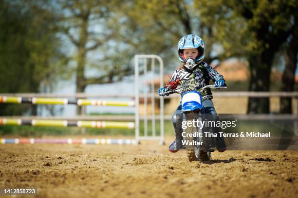 5 year old boy riding motocross. - extreme sports kids stock pictures, royalty-free photos & images