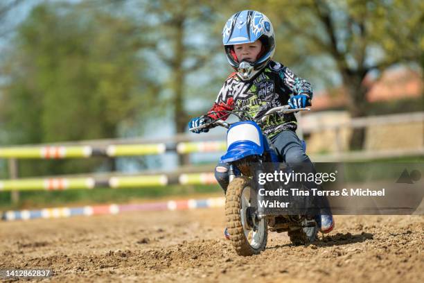 5 year old boy riding motocross. - 4 wheel motorbike stock pictures, royalty-free photos & images