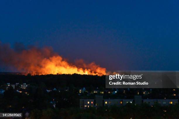 big forest fire near houses in big city. berlin - burning sage stock pictures, royalty-free photos & images